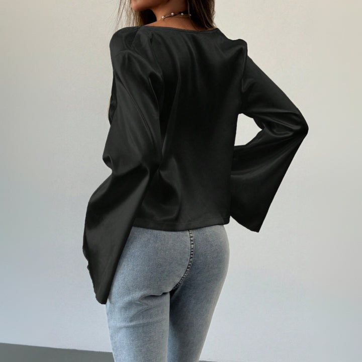 Blouse élégante femme avec décolleté en V profond et détail de nœud décontracté Chic & Stil