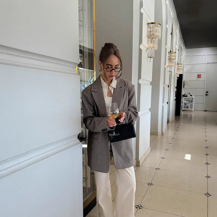 Women's long oversized wool blend coat with single-breasted button placket, notched lapels, and side pockets Amarae