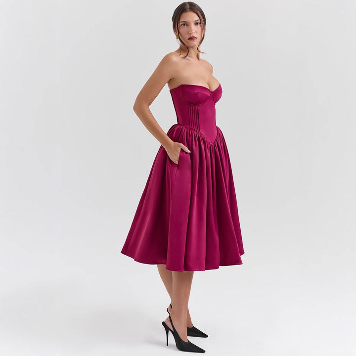 Ladies' couture dress in an off-the-shoulder strap design with a voluminous skirt Lune London