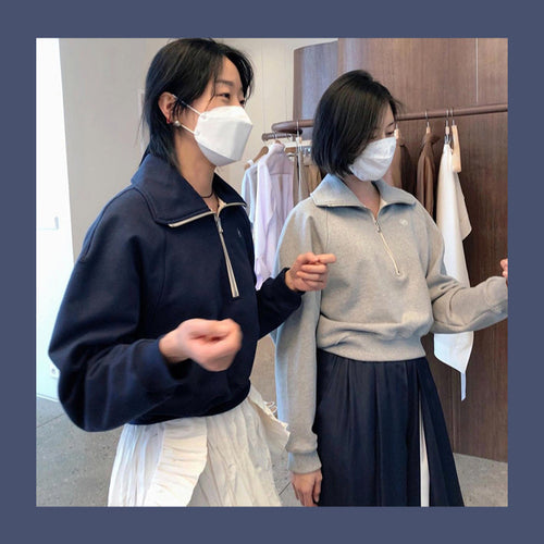 Pull à capuche stylé pour femme avec demi-zip Chic & Stil