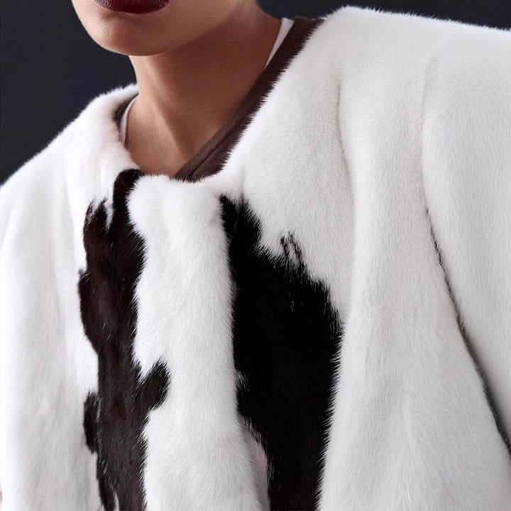 Women's short coat made of faux fur with boxy silhouette and cow print pattern Amarae