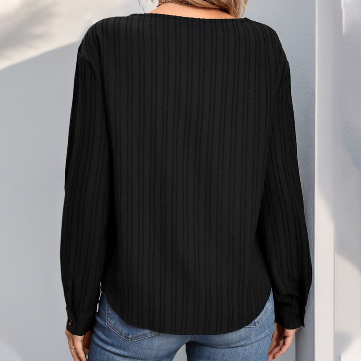 Women’s knit top with a unique V-neckline and a button placket Lune London