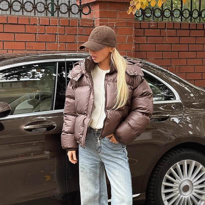 Women's short-cut shiny quilted jacket with high stand-up collar and snap-button placket Amarae