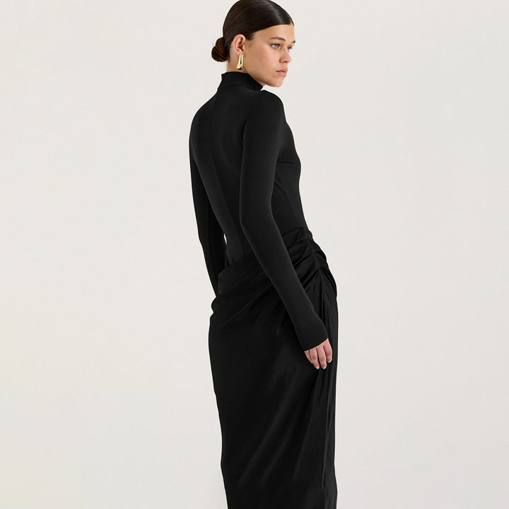 Elegant long sleeve maxi dress for women with a fitted cut and refined draping detail Lune London