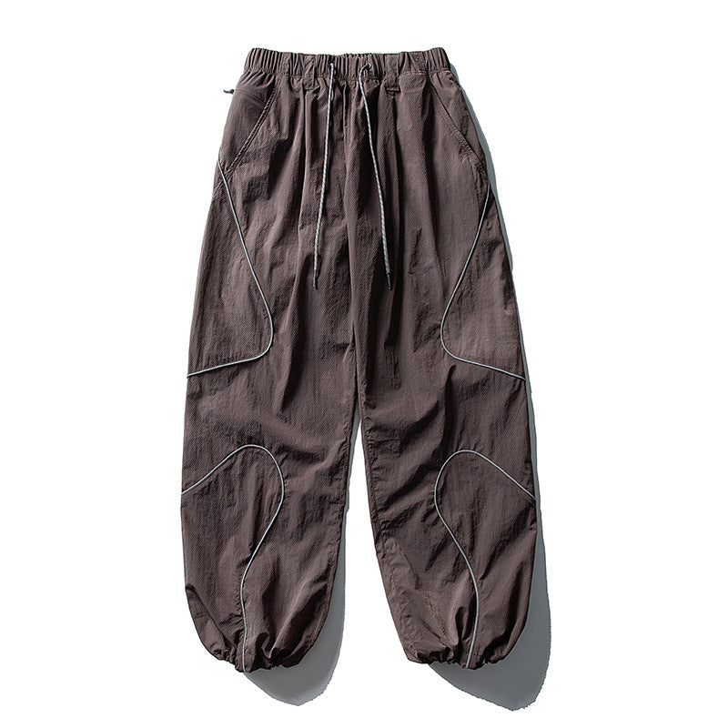 Men's loose utility harem pants made of ripstop with drawstring waistband, shaped panels, and elastic ankle cuffs Amarae