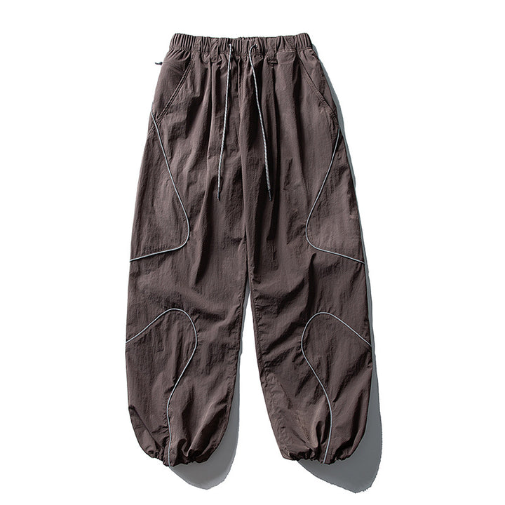 Men's loose utility harem pants made of ripstop with drawstring waistband, shaped panels, and elastic ankle cuffs Amarae