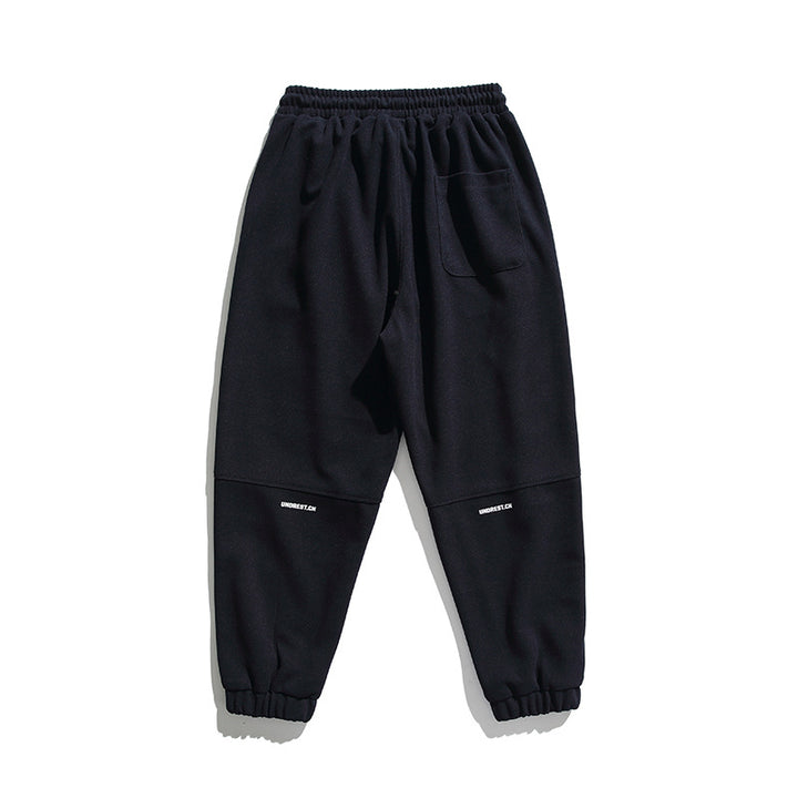 Unisex wide jogging pants in oversized cut with elastic waistband, knee panel and ribbed cuffs Amarae