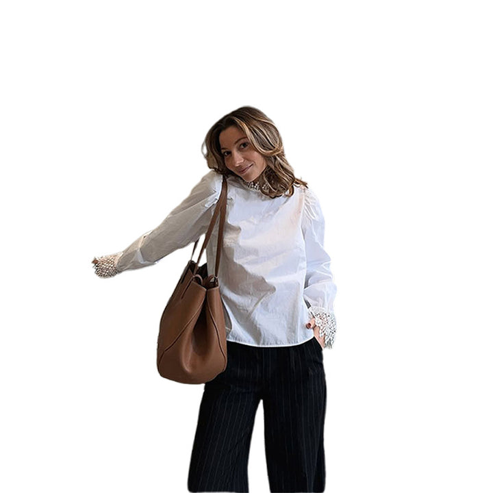 Blouse for women with elegant lace accents and puff sleeves Lune London