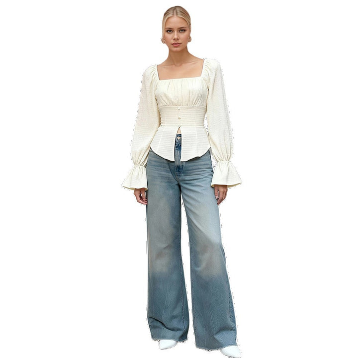 Top femme avec des manches bouffantes et des détails de nœud sophistiqués Chic & Stil