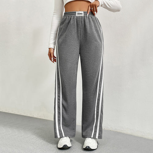 Pantalons de loisirs sportifs pour femmes avec coupe large et rayures contrastées Chic & Stil