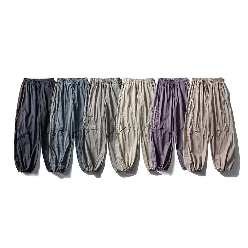 Men's loose technical nylon cargo pants with elastic waistband and panel details Amarae