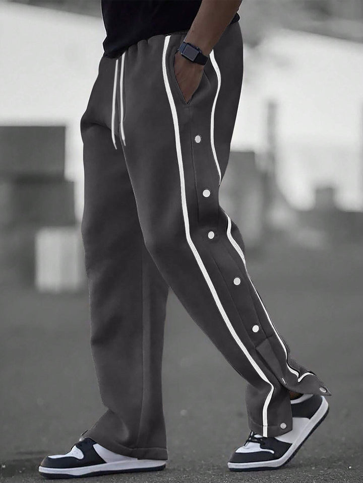 Stylish men's sports pants with snap button details and side pockets Lune London