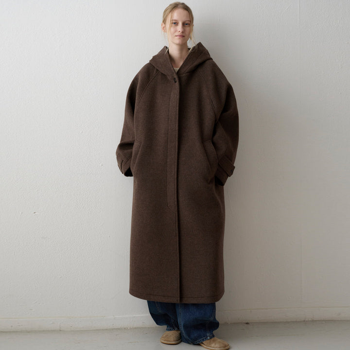 Manteau en laine surdimensionné pour femmes avec capuche et poches pratiques Chic & Stil