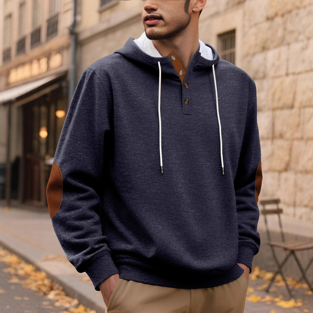Hooded man with modern design of button placket and elbow patches Lune London