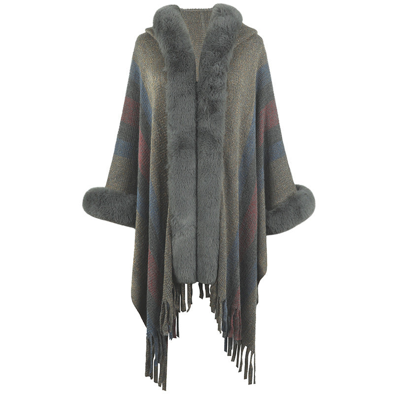 Women fashionable poncho with luxurious faux fur collar and fringes Lune London