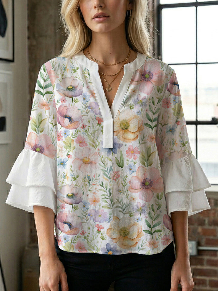Ladies elegant top with voluminous ruffle hems and floral design Lune London