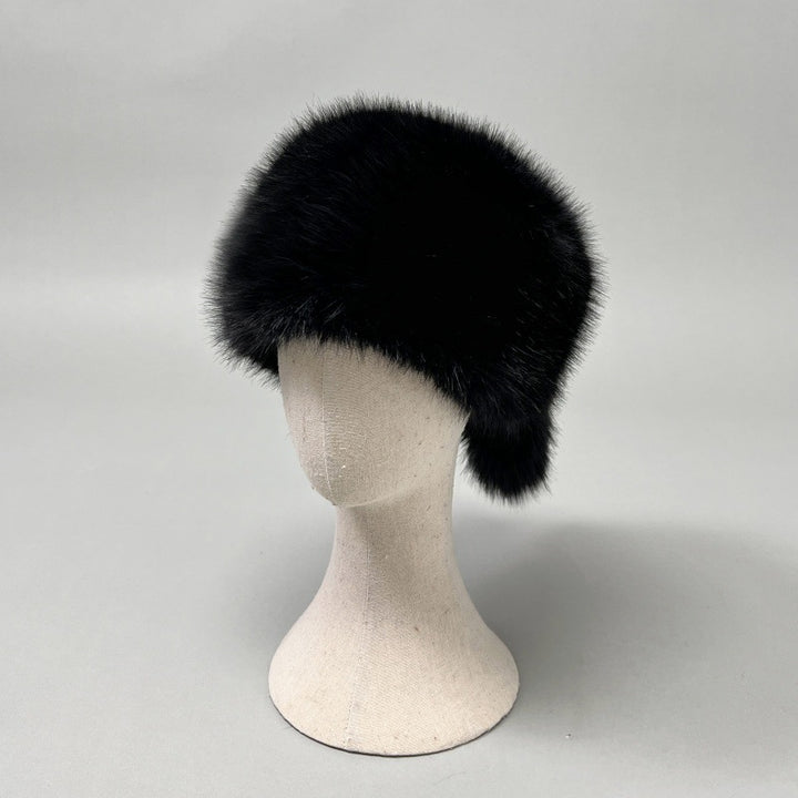 Women’s plush faux fur trapper hat with earflaps and decorative tail Amarae