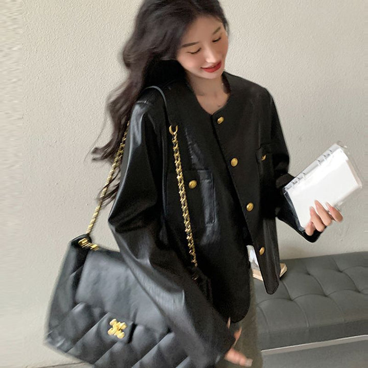 Veste en faux cuir pour femmes avec des boutons dorés Chic & Stil