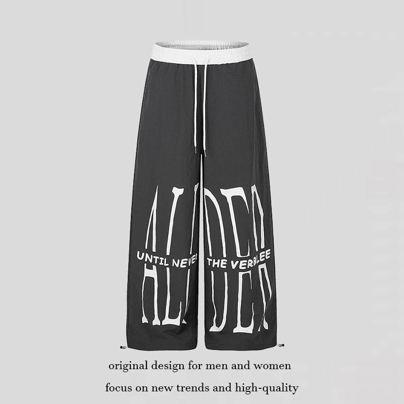 Women's wide loungewear pants with high comfort waistband, drawstring, adjustable hem, and typographic print Amarae