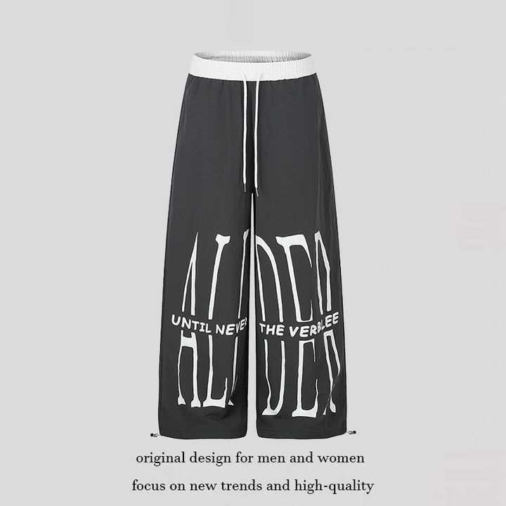 Women's wide loungewear pants with high comfort waistband, drawstring, adjustable hem, and typographic print Amarae