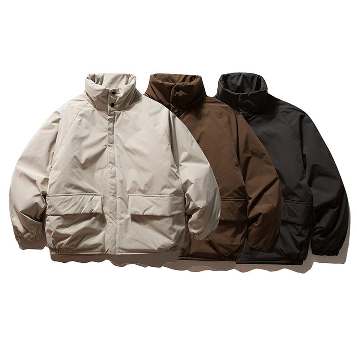 Unisex Boxy Padded Transition Jacket with High Stand-Up Collar, Elastic Cuffs and Flap Pockets Amarae