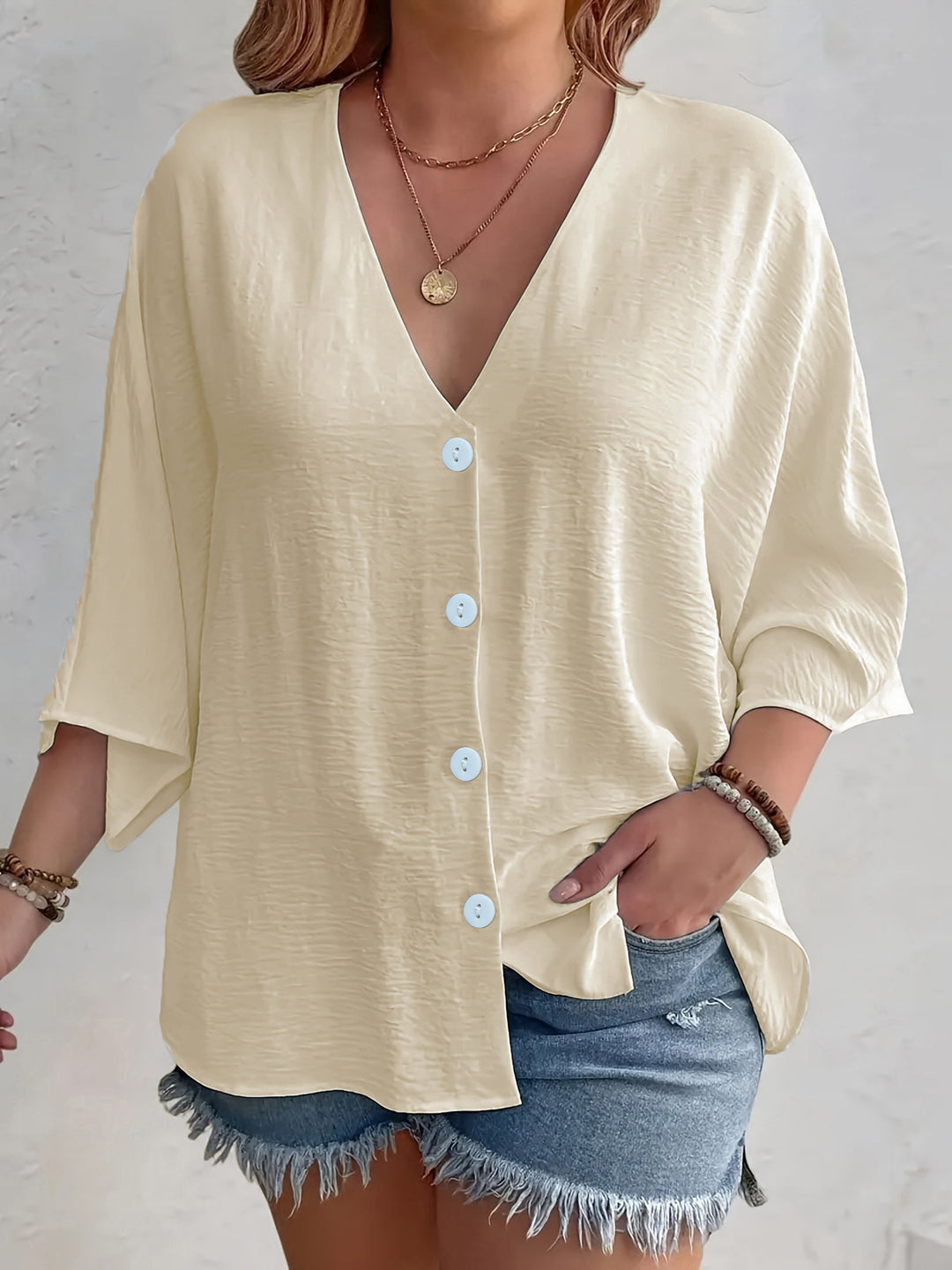 Short-sleeved advantageous blouse for ladies with button placket and V neckline Lune London