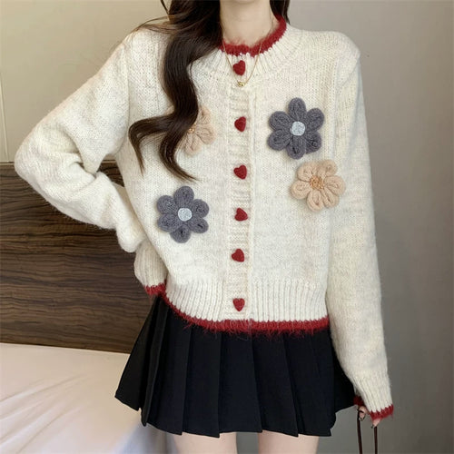 Ladies playful pullover with heart-shaped button closure and floral appliqués Amarae