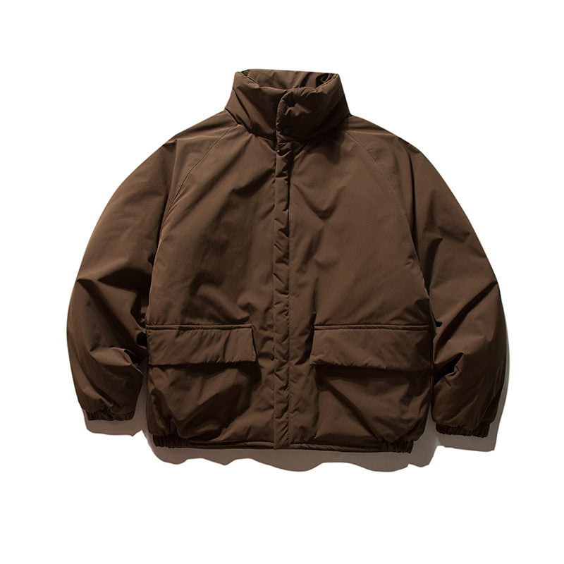 Unisex Boxy Padded Transition Jacket with High Stand-Up Collar, Elastic Cuffs and Flap Pockets Amarae