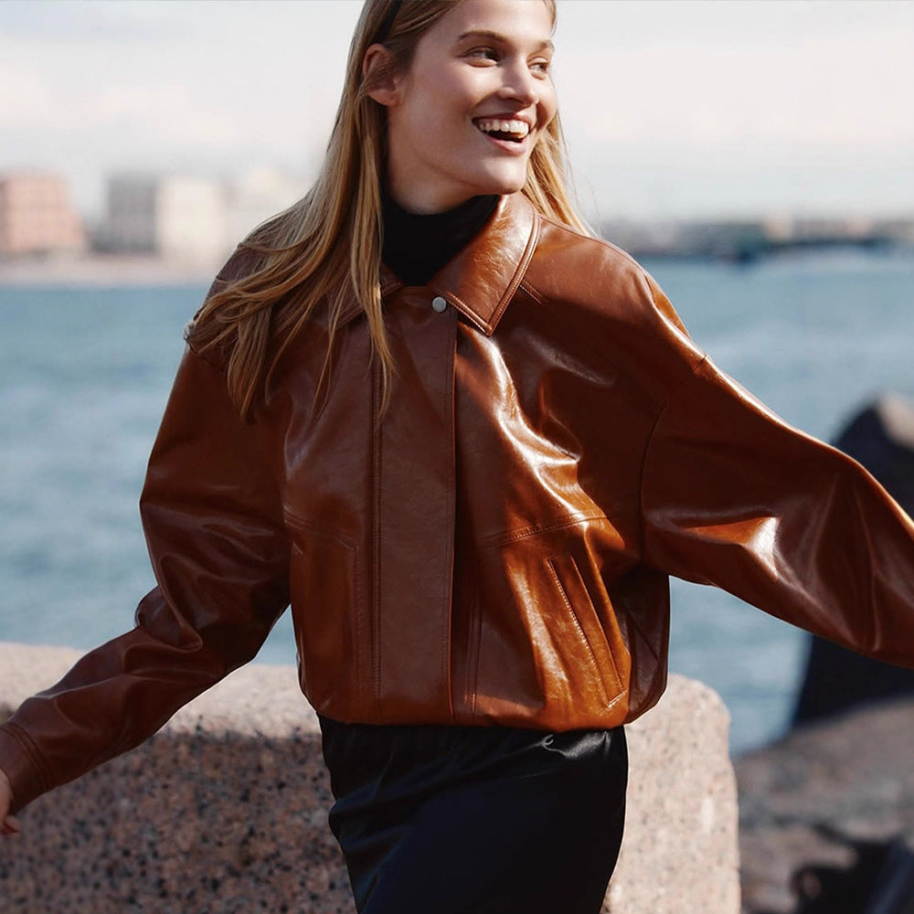 Women's short blazer made of vegan smooth leather with boxy silhouette and concealed snap button placket Amarae