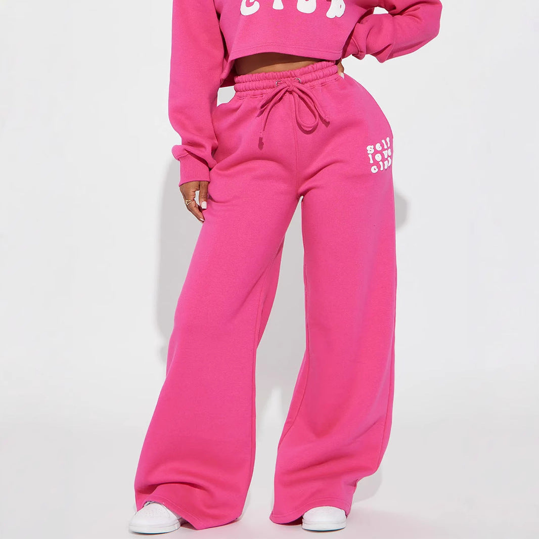 Women's wide jogging pants with elastic waistband and eye-catching lettering Chic & Stil
