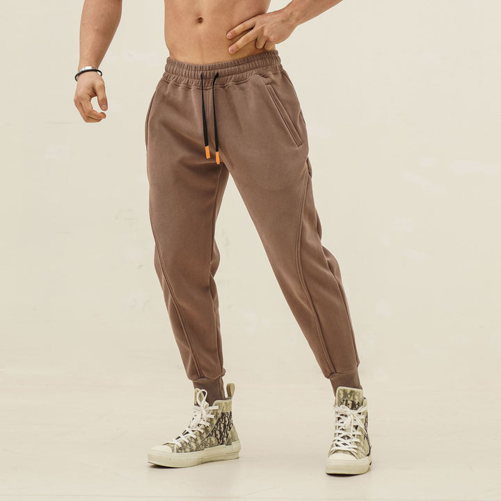 Sporty jogger pants for men with elastic waistband and stylish contrasting stripes Lune London