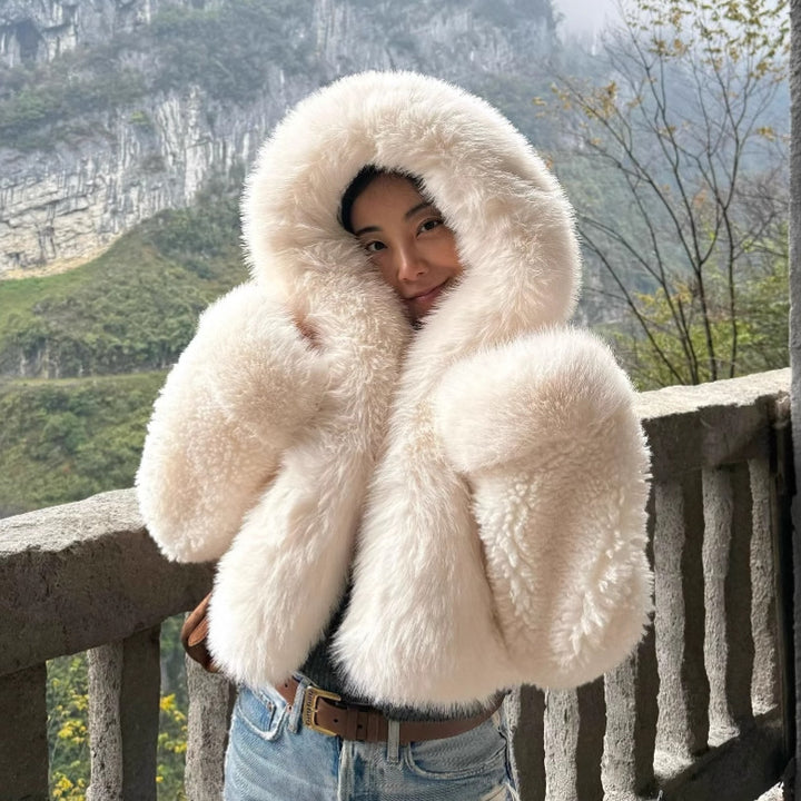 Women's short jacket made of voluminous faux fur with XXL hood and ball sleeves Amarae