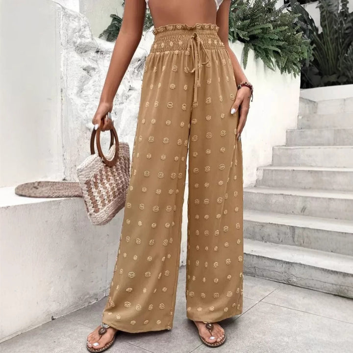 Wide palazzo pants for women with elastic waistband and decorative pattern Lune London