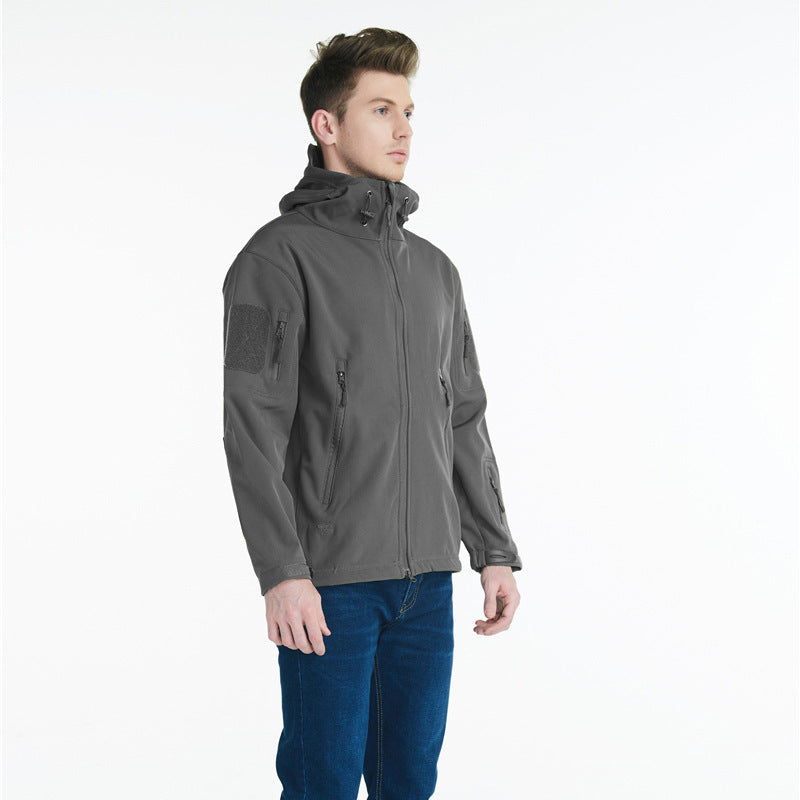 Tactical softshell jacket for men with numerous zipped pockets and an adjustable hood collar Lune London