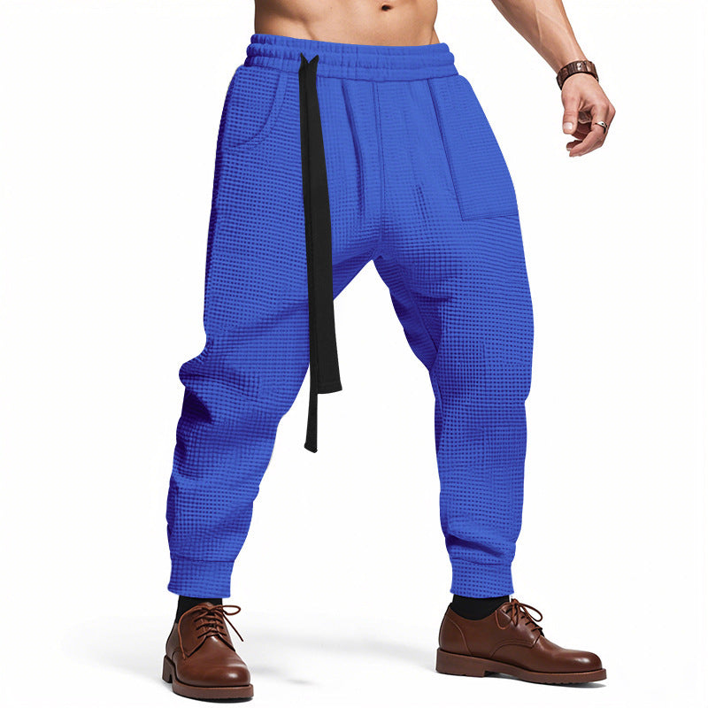 Casual men's jogging pants in textured fabric with elastic waist and drawstring Lune London
