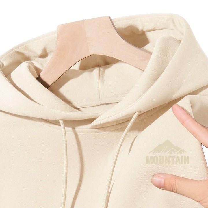 Women's hoodie with modern mountain motif and practical pockets Chic & Stil