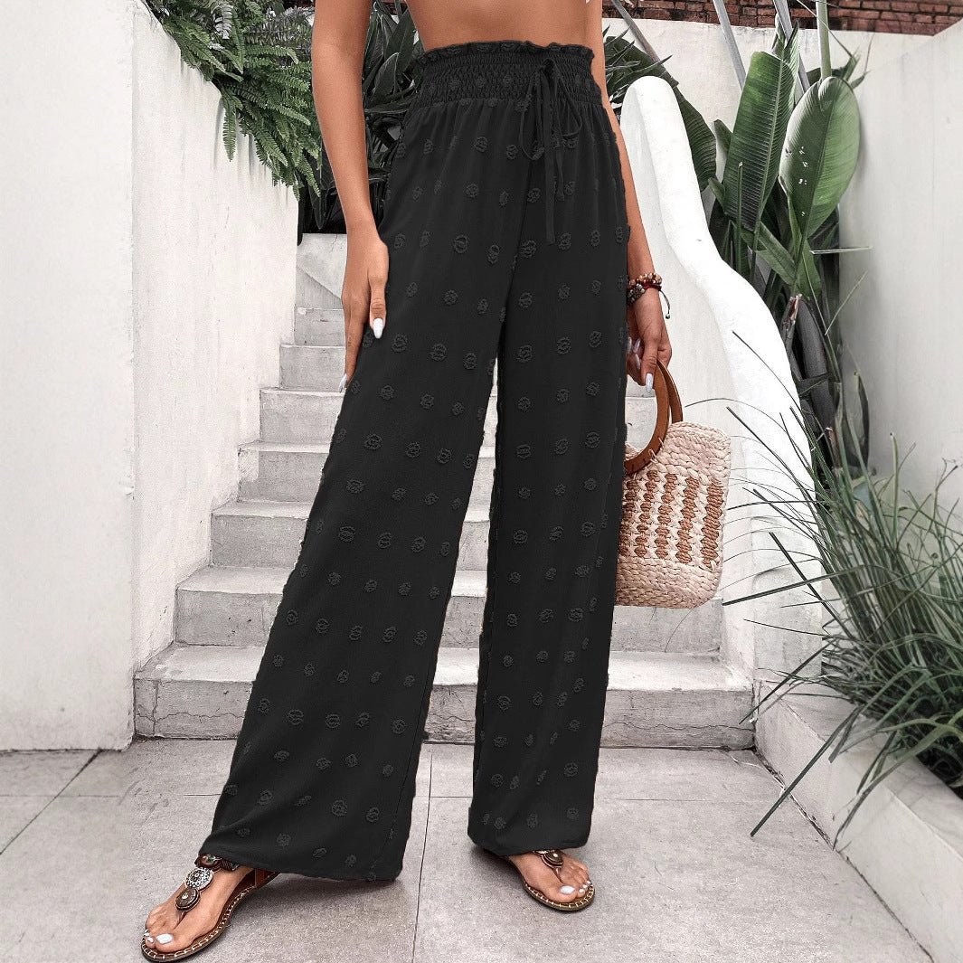Wide palazzo pants for women with elastic waistband and decorative pattern Lune London