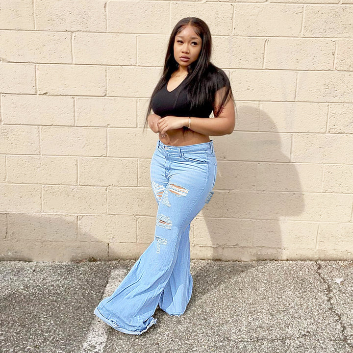 Women's high-waisted flared jeans with large rips and extra wide hem Amarae