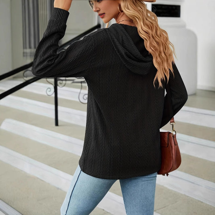 Casual hooded sweater for women with textured fabric and decorative button details Lune London