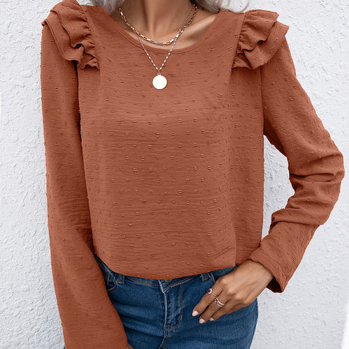 Casual women's top with ruffle details and textured surface Amarae