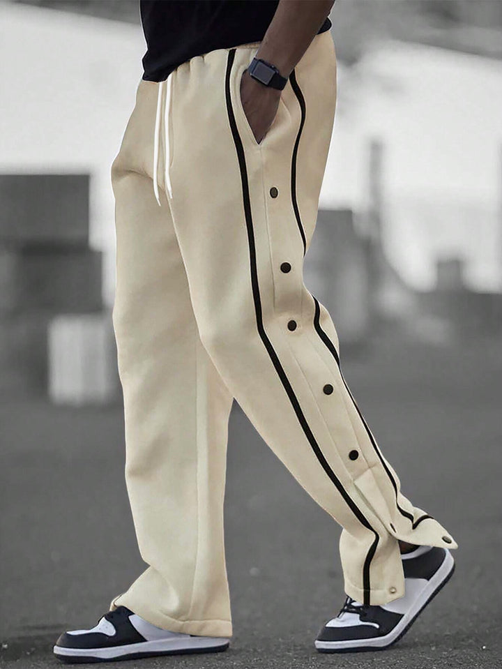 Stylish men's sports pants with snap button details and side pockets Lune London