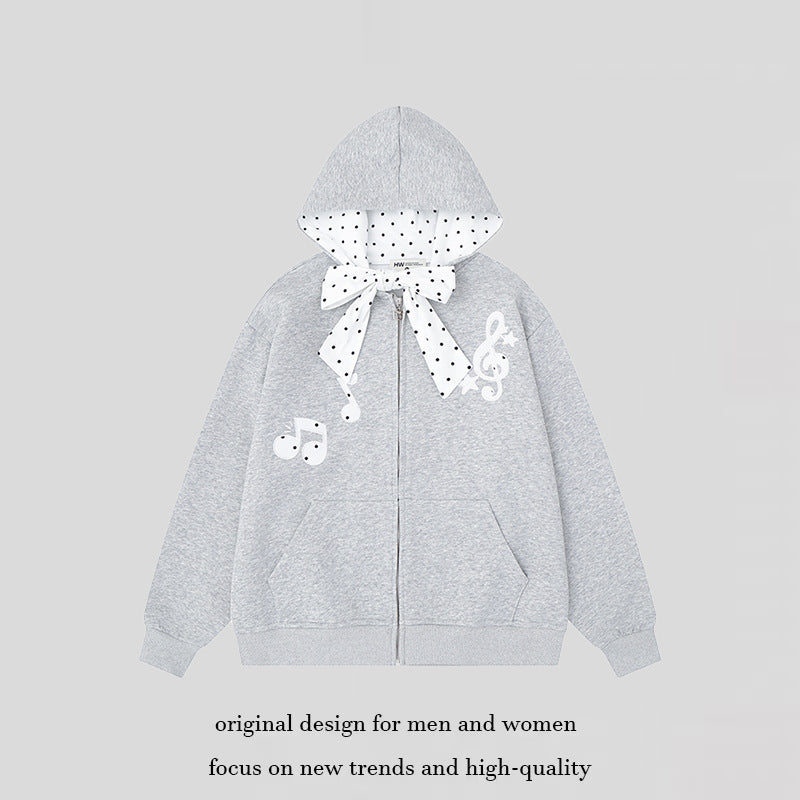 Women's hooded sweat jacket with polka dot hood lining, decorative bow, and music notes motif Amarae