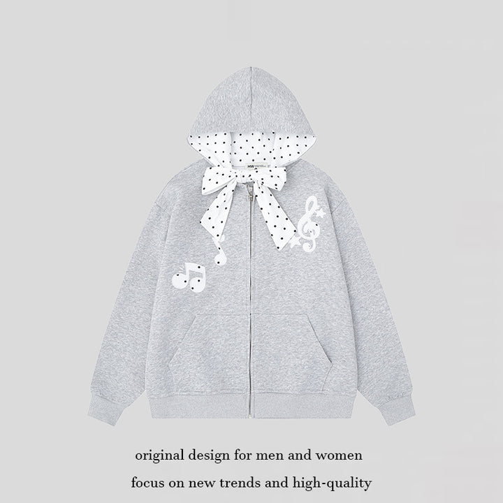 Women's hooded sweat jacket with polka dot hood lining, decorative bow, and music notes motif Amarae
