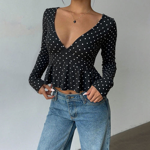 Chemisier pour femmes avec coupe peplum et motif à pois Chic & Stil