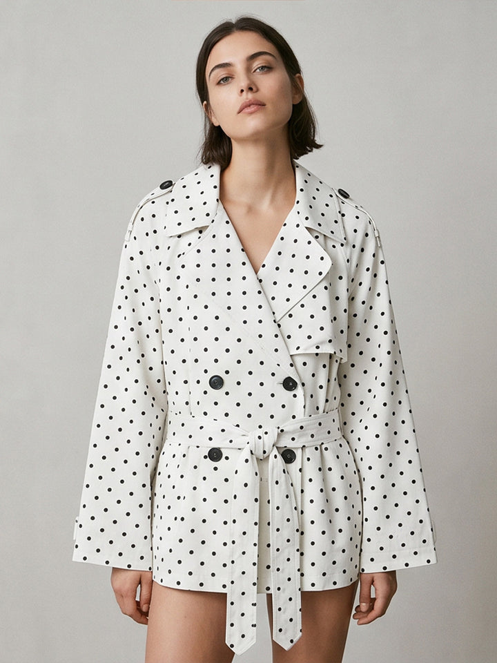 Women’s short trench coat with double breasted front, belt at the waist and polka dot print Amarae