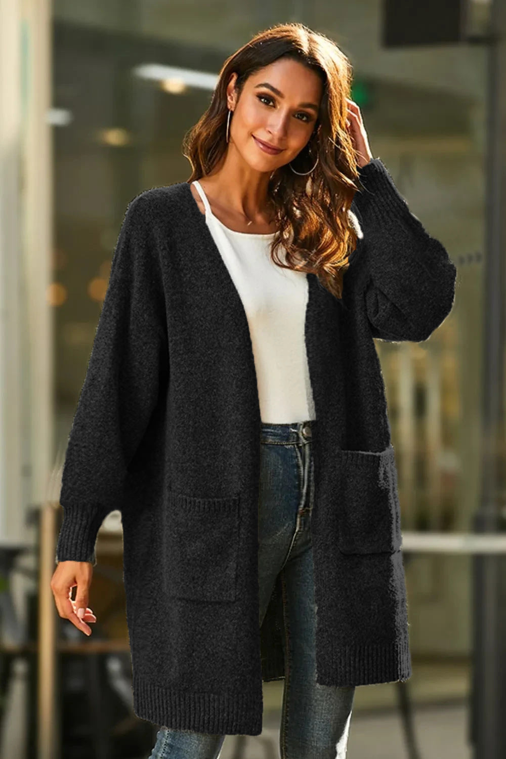 Women Long knitted cardigan with a soft texture and practical pockets Lune London