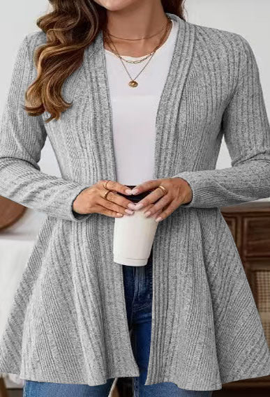 Women’s knitted jacket with a playful design and a chic side belt.