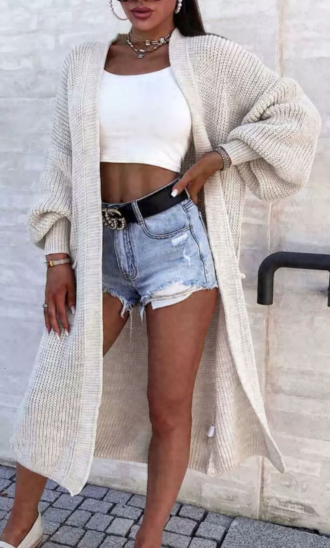 Long knitted coat for women with oversized sleeves and practical pockets Lune London