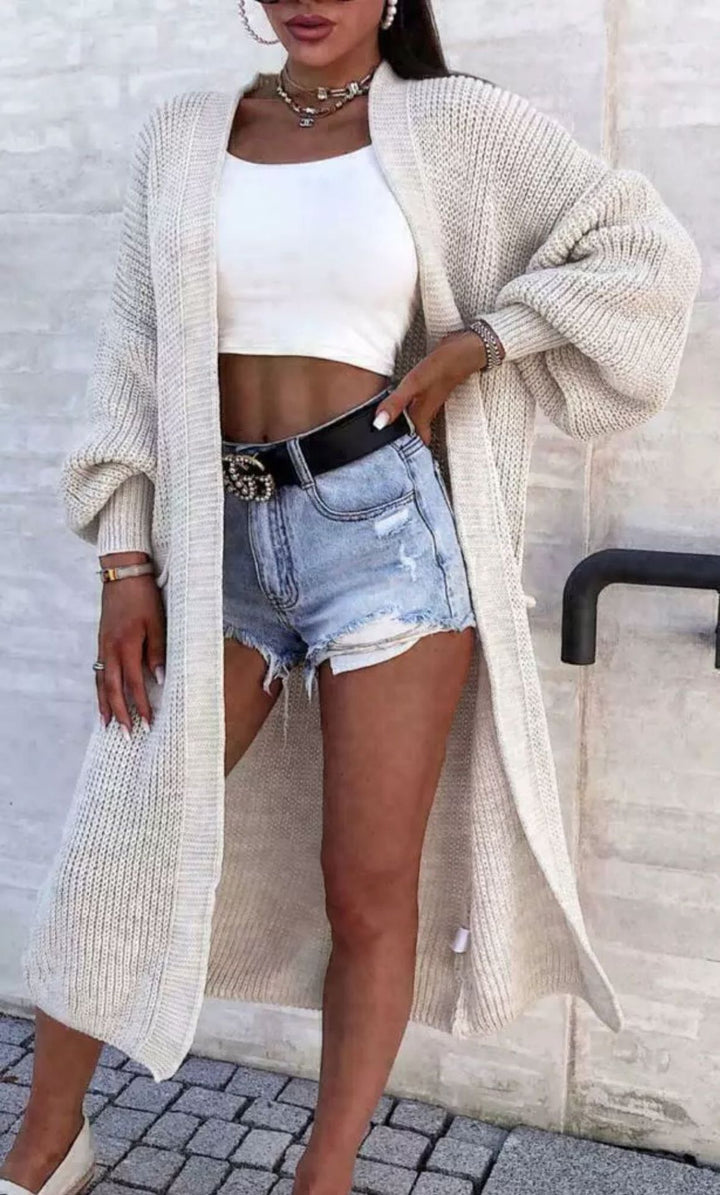 Long knitted coat for women with oversized sleeves and practical pockets Lune London