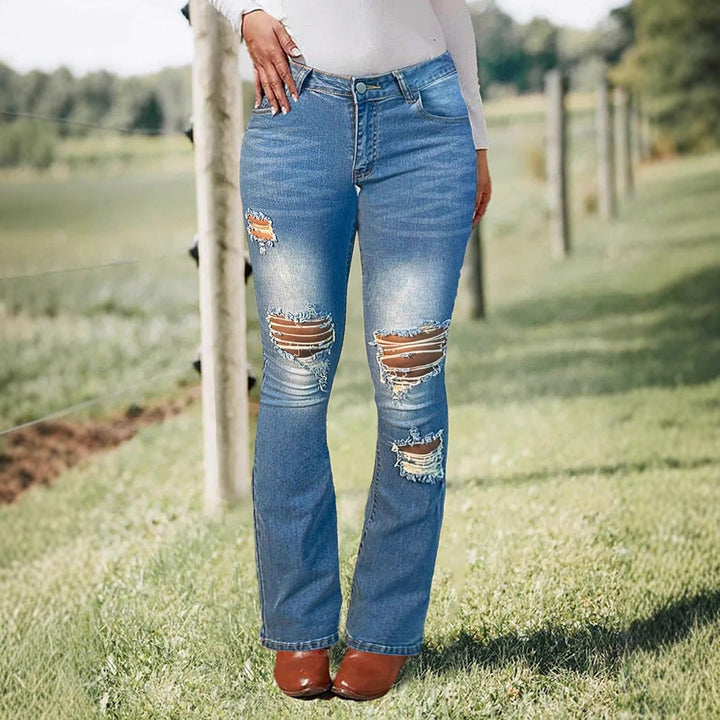 Women's waist-accentuated stretch denim jeans with flared leg and prominent knee rips Amarae